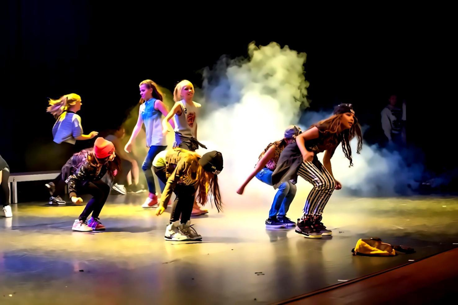Student working through choreography during a live online session